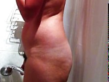 Hidden cam of sexy busty amateur MILF taking a shower p